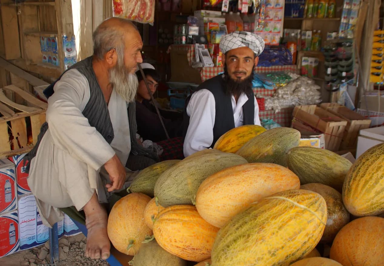 Fruit sellers with honeydew melons in Aqcha, Jowzjan