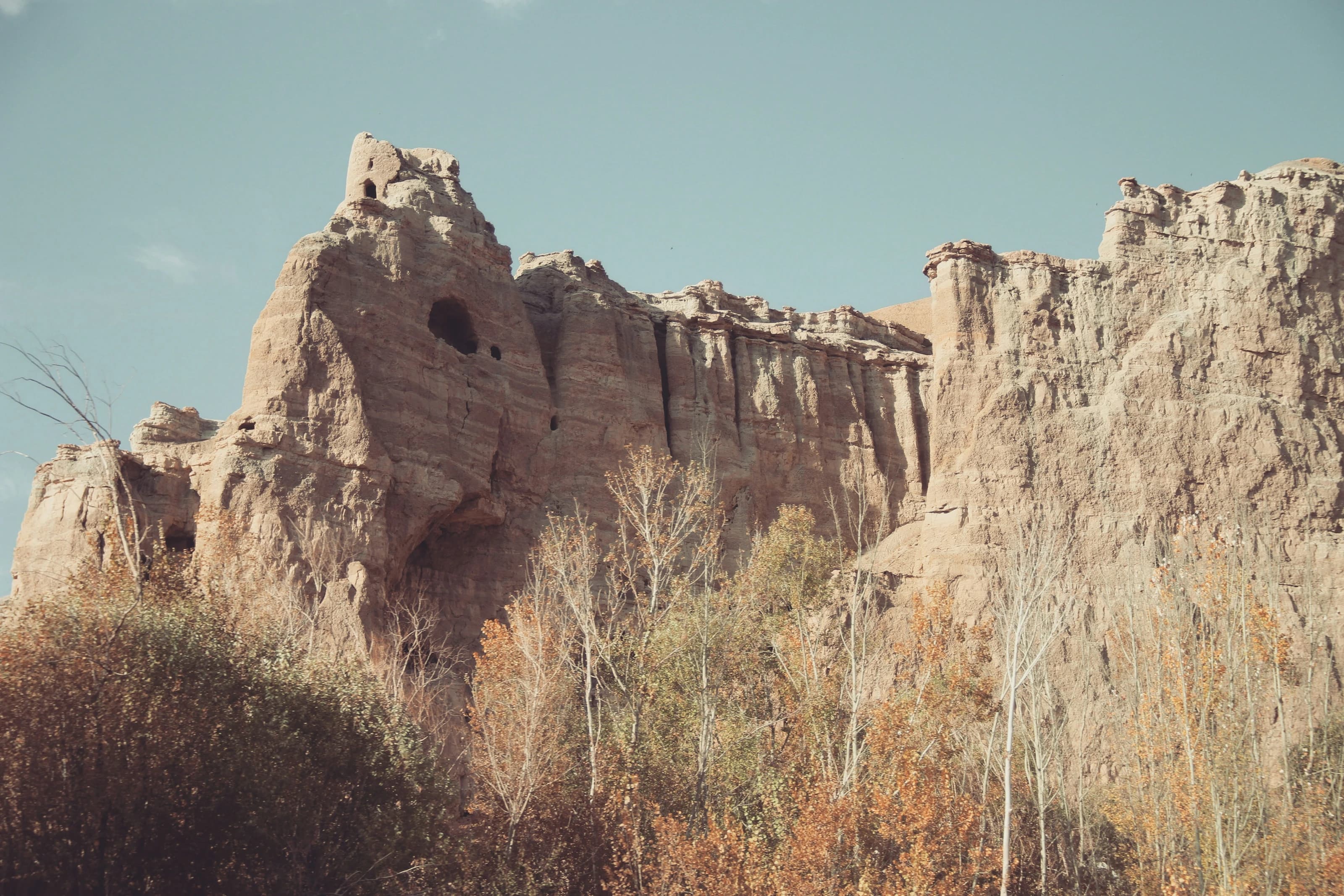 Ancient earthen ruins against the mountains of Bamyan