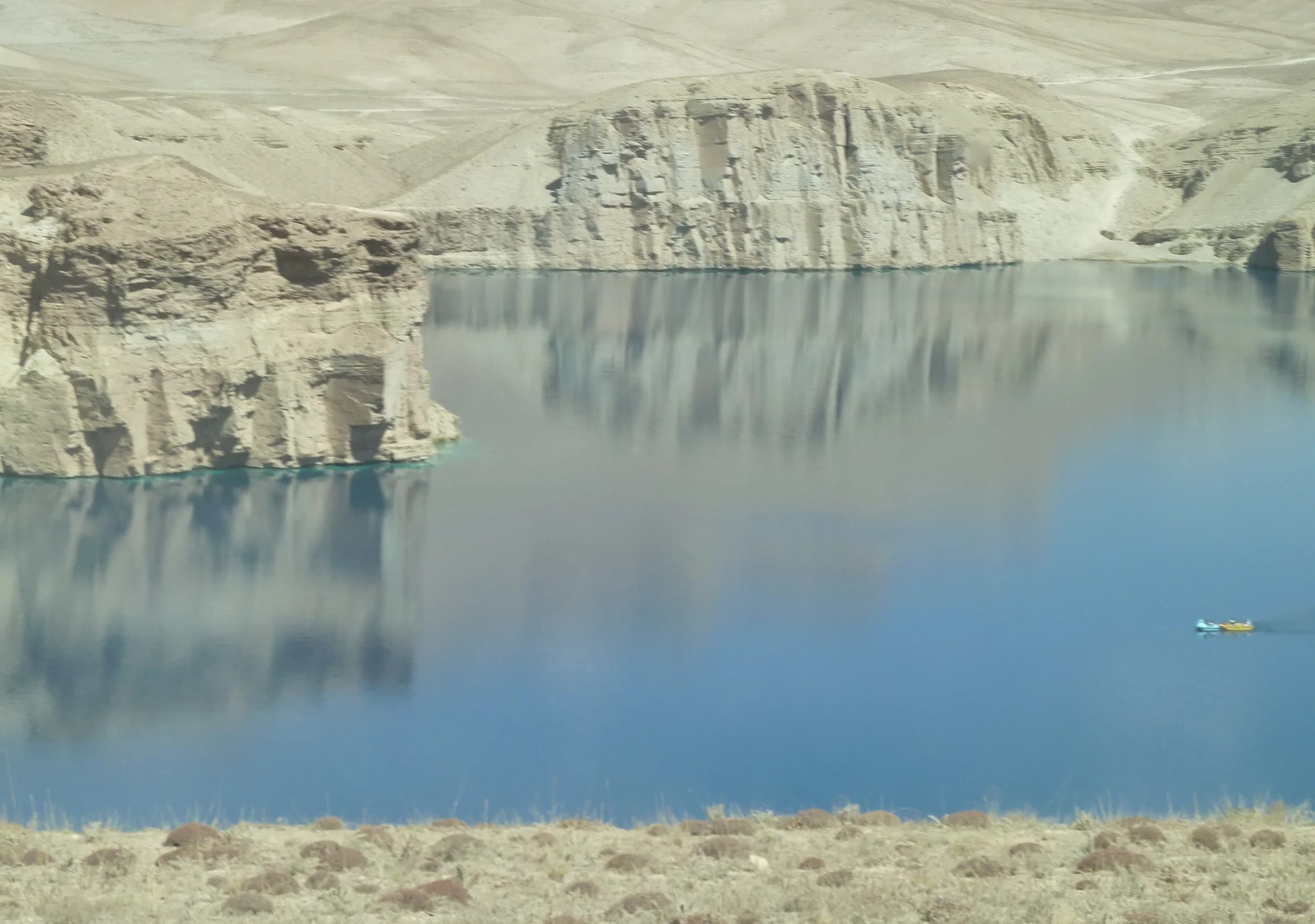 A lake framed by pale travertine cliffs in Band-e Amir National Park, Bamyan