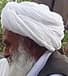 An elder in a white turban among village elders gathered at the local mosque in Alingar District, Laghman, 2015