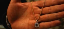 A handcrafted silver necklace photographed in Herat