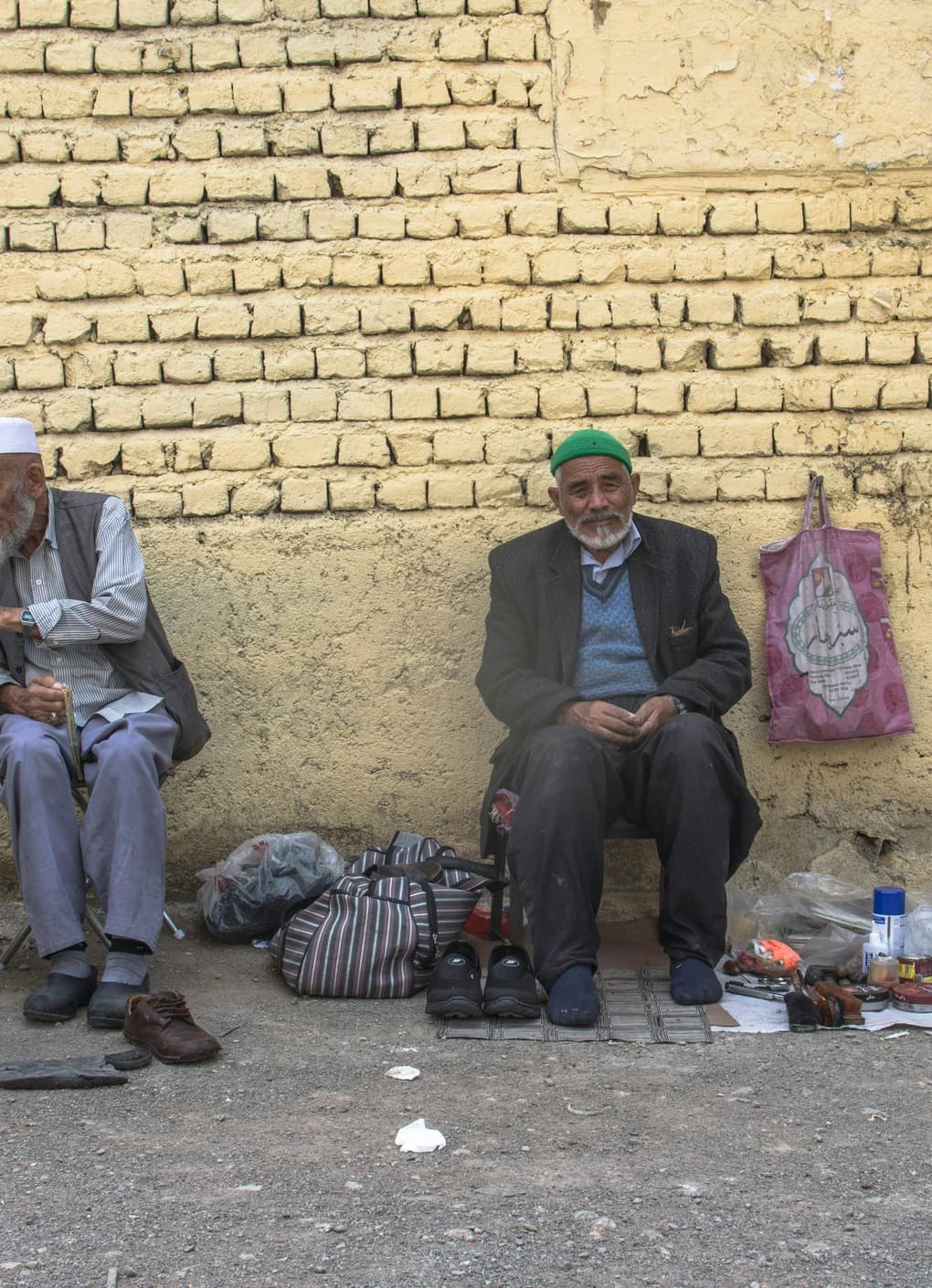 Neighbours gathered along an Afghan street