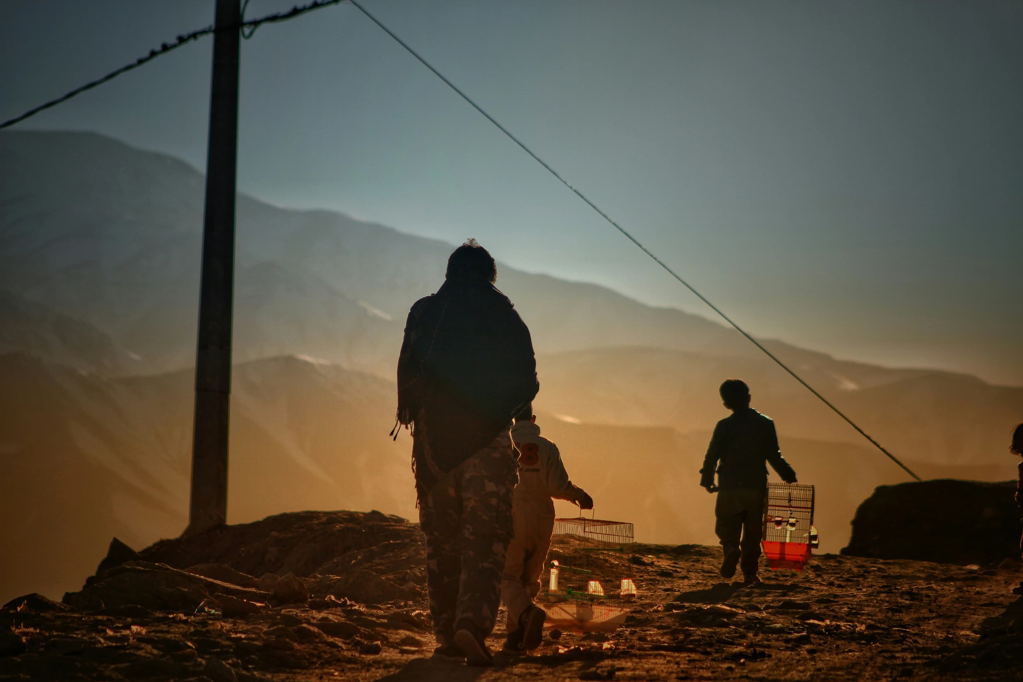 People on a Kabul hillside in the evening light