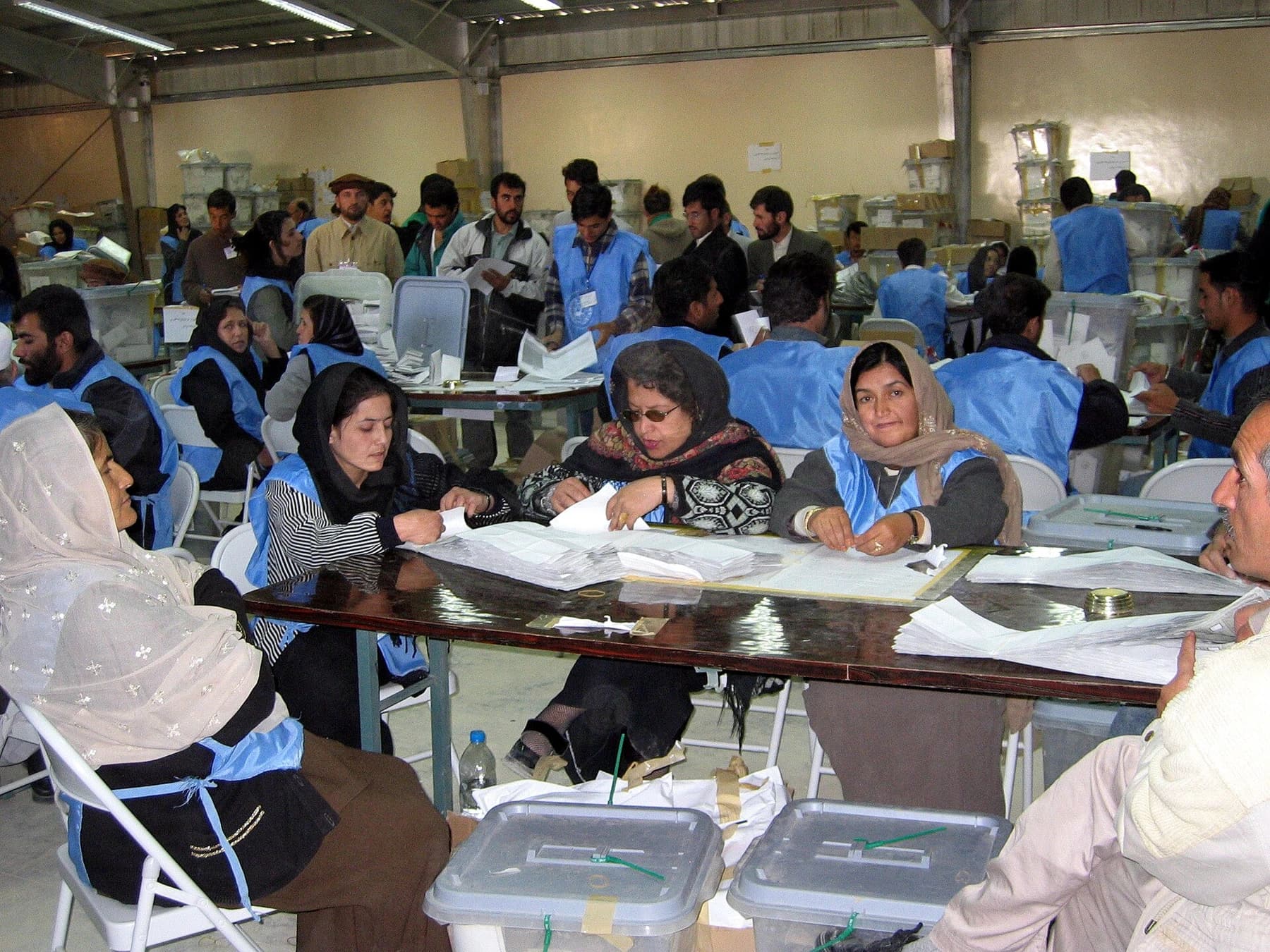 Election workers counting presidential ballots in Kabul, October 2004