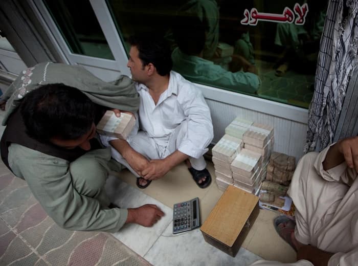Stacks of cash at a Kabul money exchange market, photographed in 2010