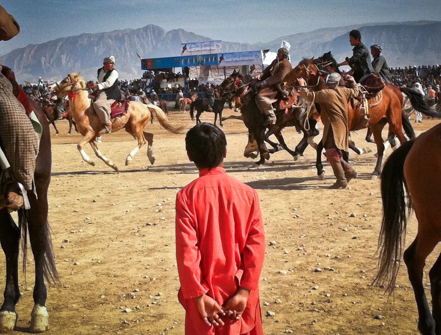 Spectators and riders at a Nowruz buzkashi gathering in Mazar-e-Sharif