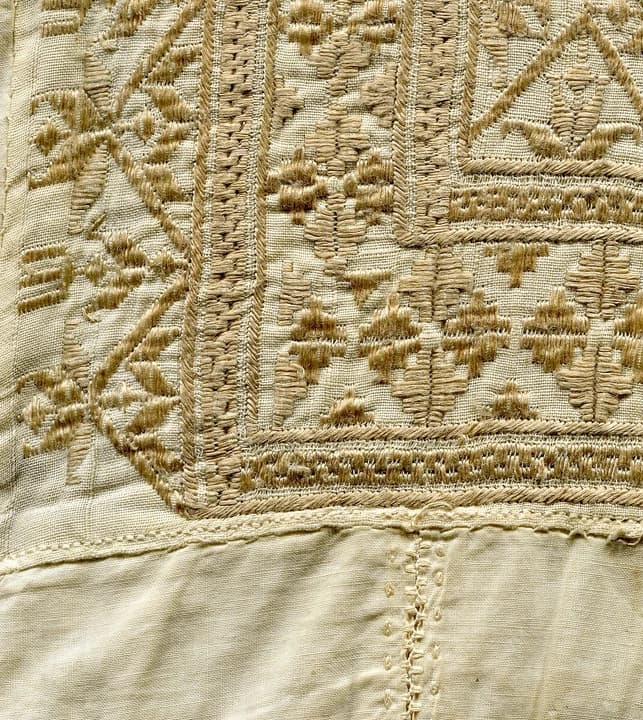 Fine white embroidery on a traditional Afghan man’s smock