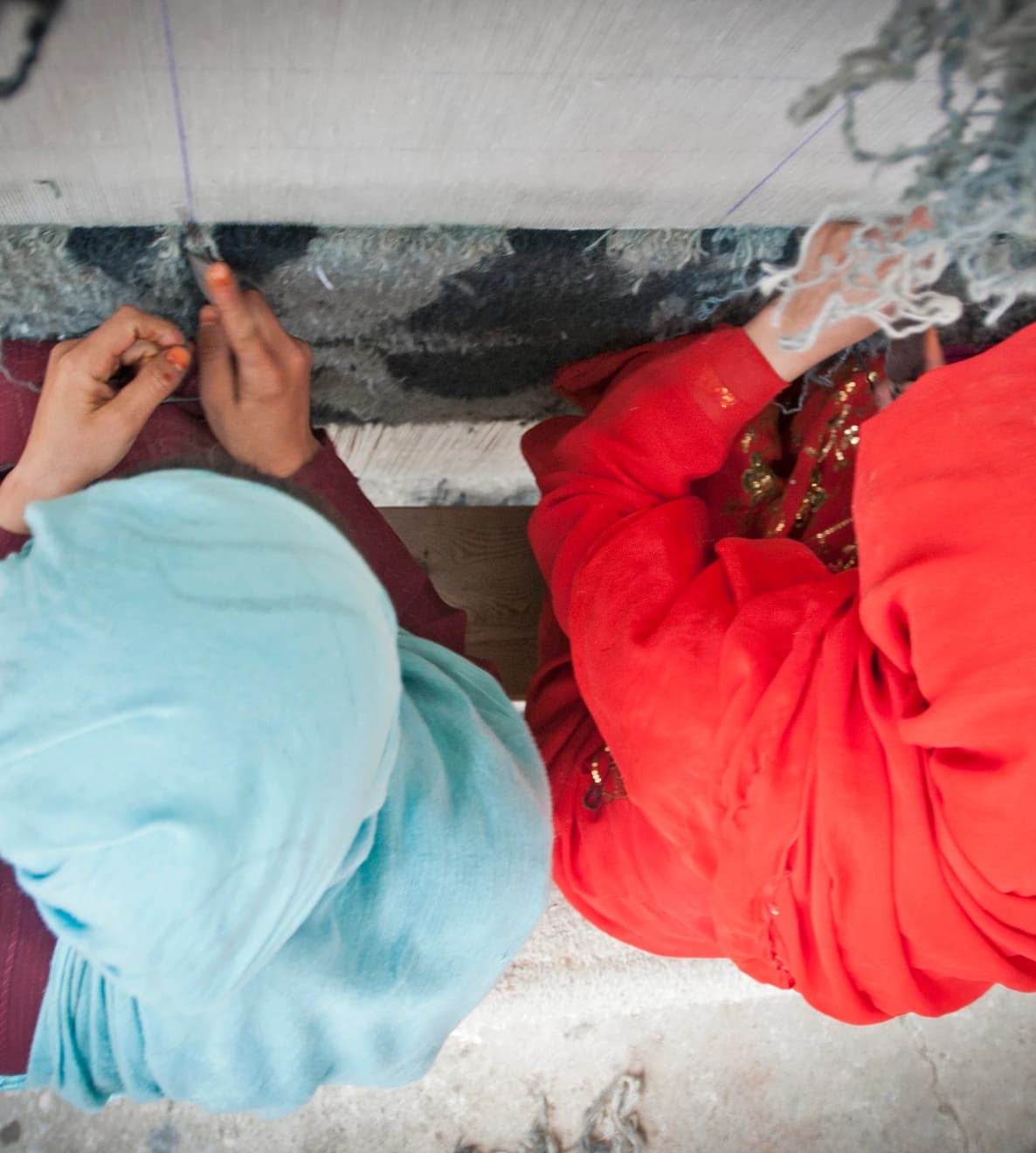 Women weaving carpets at Arzu Studio Hope in Bamyan