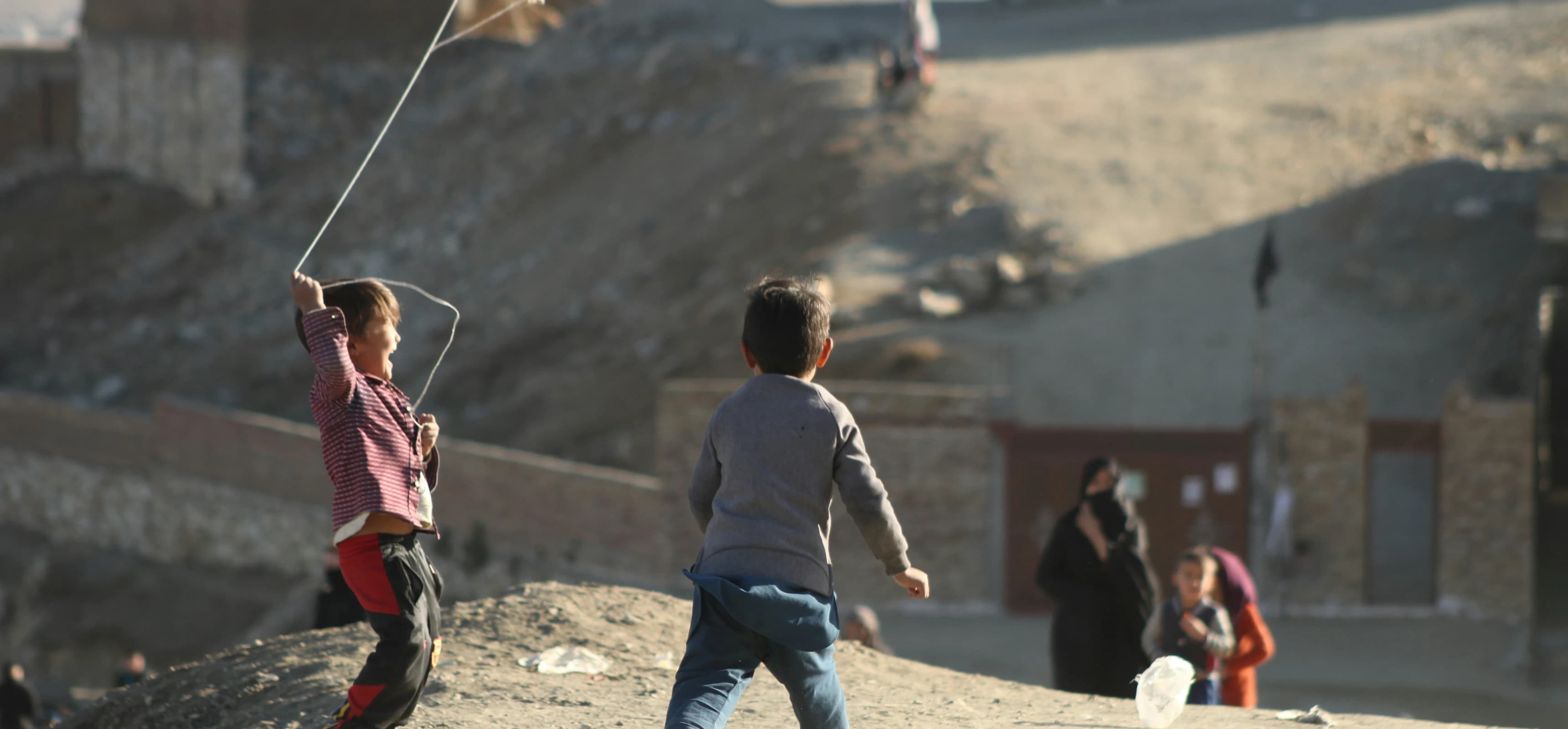 Children flying kites in Dasht-e-Barchi, Kabul