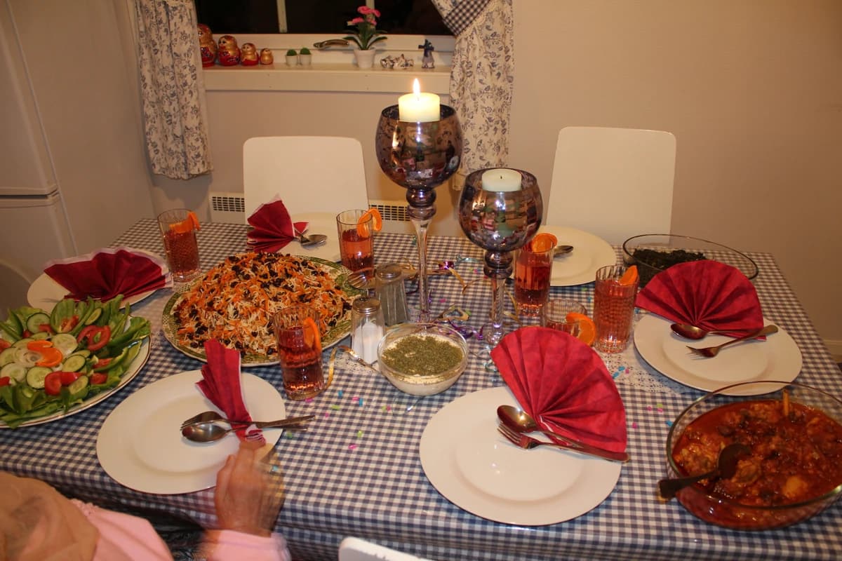 A home table set with Afghan palaw and accompaniments