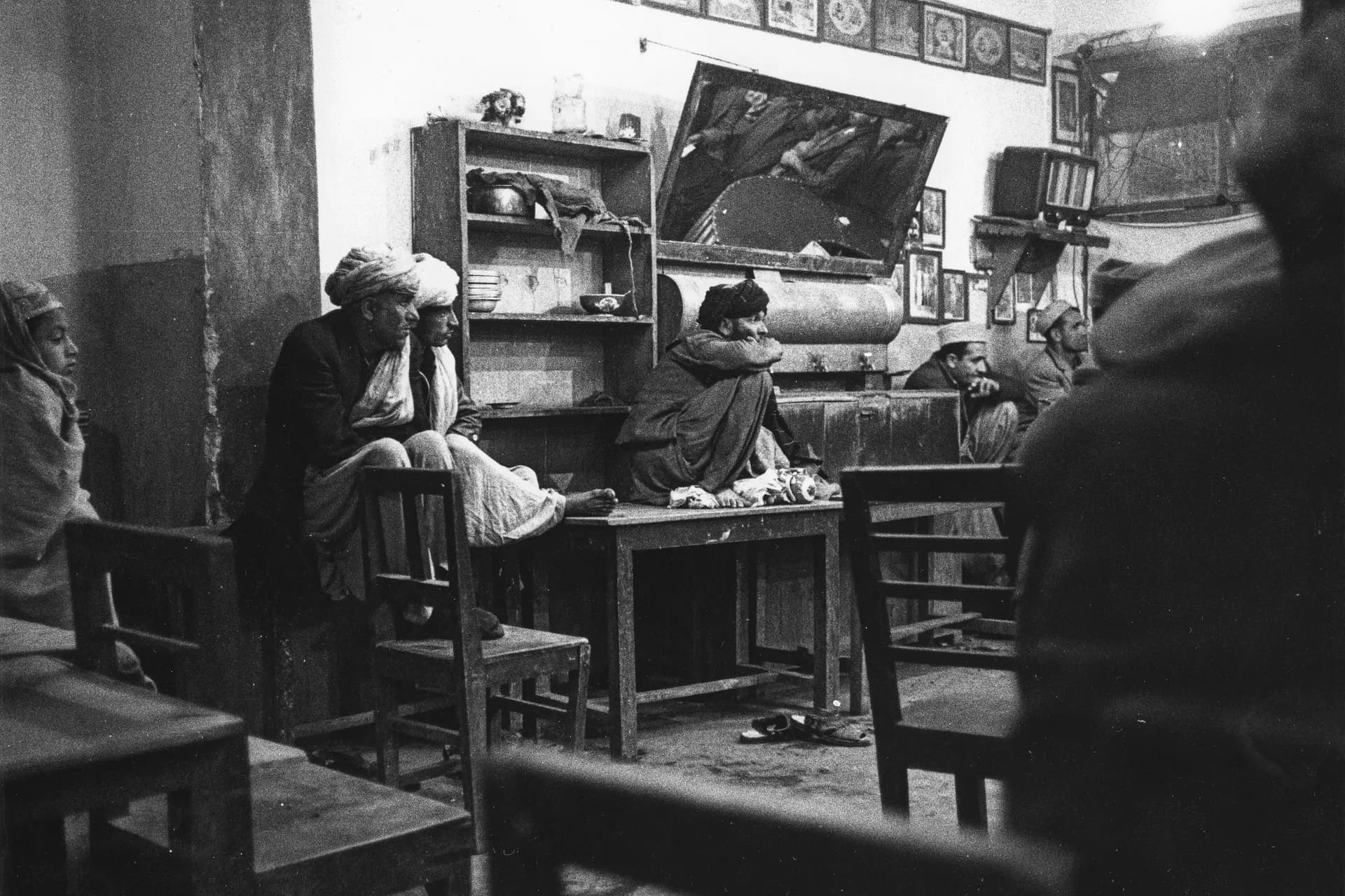 Men talking over tea inside a teahouse in Mazar-i-Sharif, Balkh, photographed by Herbert Maeder in 1967
