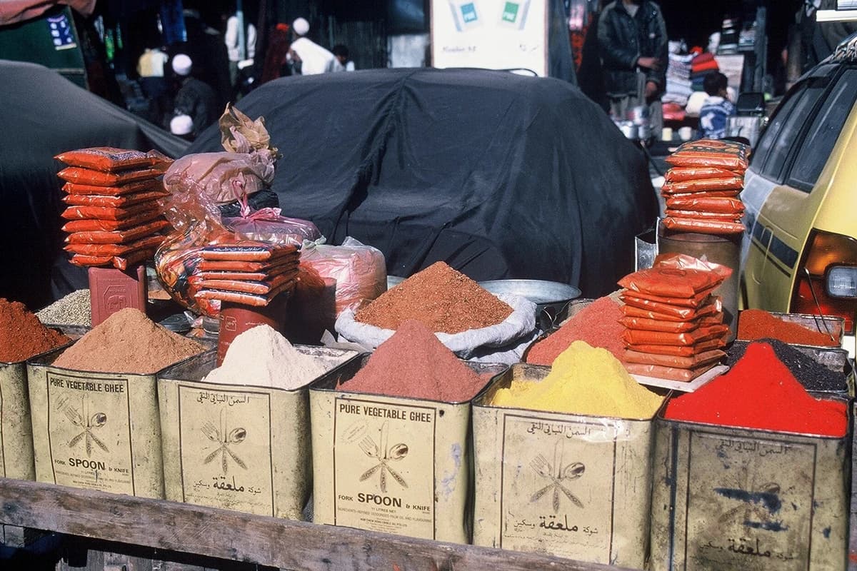 Spices and ingredients displayed at an Afghan market stall