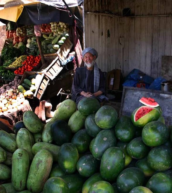 A fruit vendor at his stall in Kabul