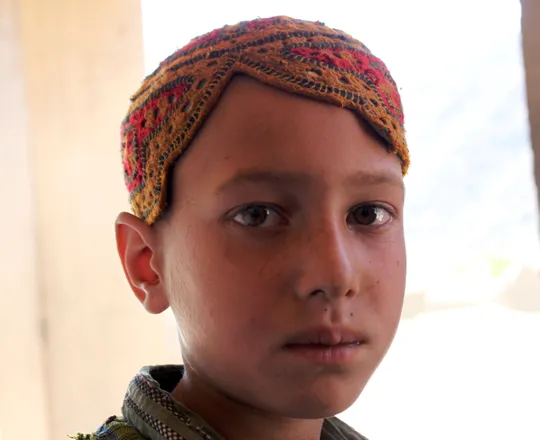 A boy in an embroidered cap in the Dara-i-Nur valley, Nangarhar, 2010