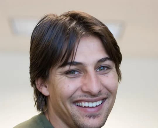 A young Afghan Pashtun man wearing a traditional collared shirt