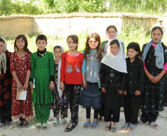 Girls in long dresses and scarves in Khwahan, Badakhshan