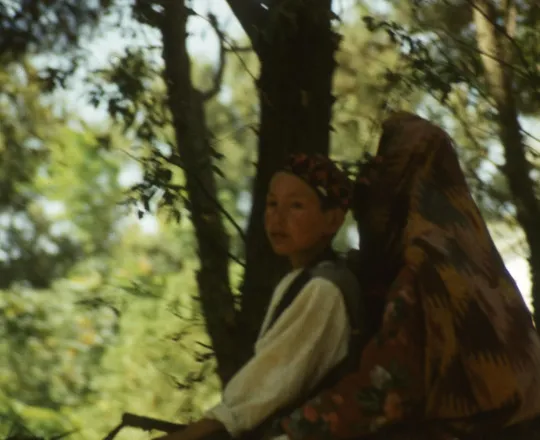 A Turkmen woman and a boy riding a donkey in Dawlatabad, Balkh, 1976