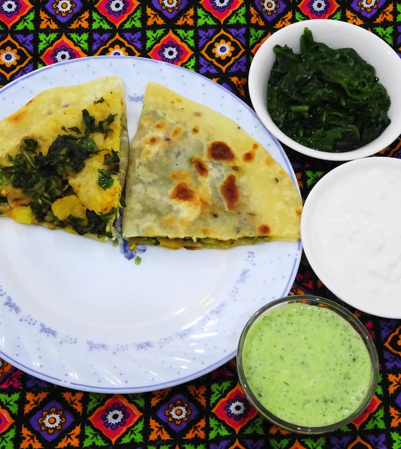 Afghan bolani served with yogurt and green chutney