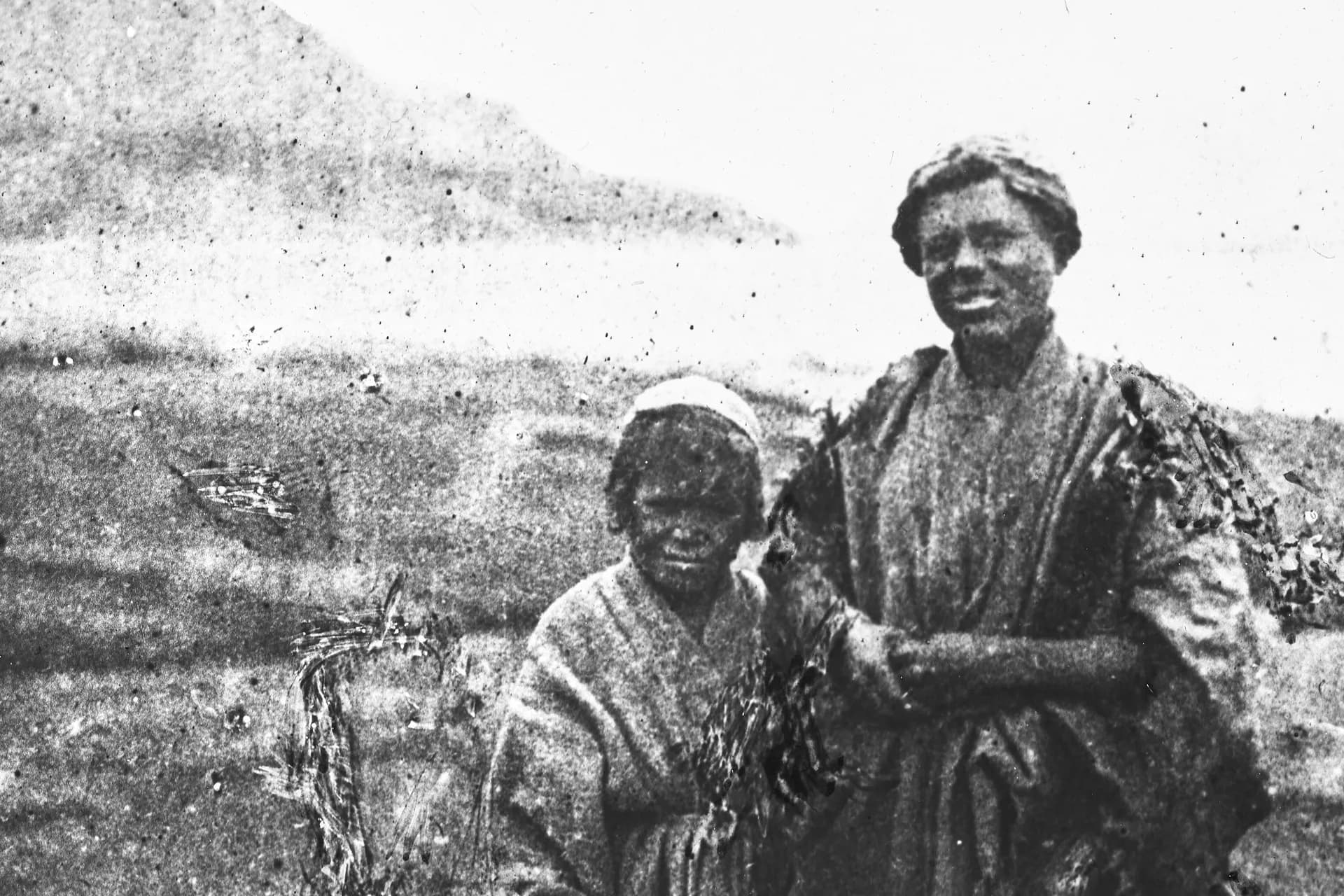 Two Wakhi boys standing together at Sarhad, Wakhan, photographed by Guillaume Capus in 1887