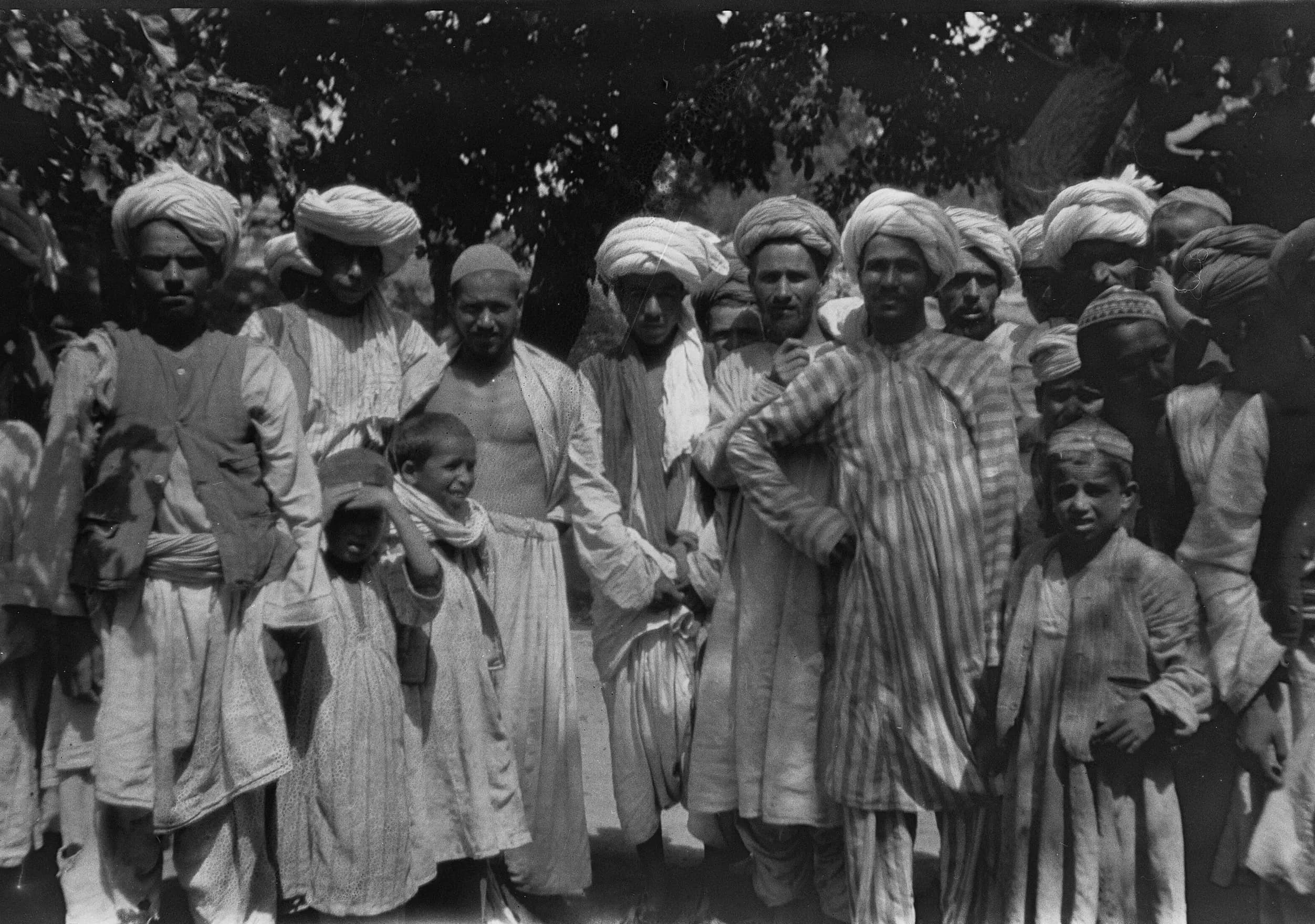 A group of Pashai children and young men in Gulbahar, north of Kabul, photographed by linguist Georg Morgenstierne in 1924