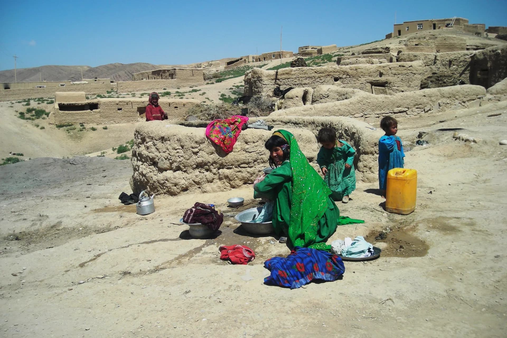 A family outside their home in a village near Chaghcharan, Ghor Province, 2007