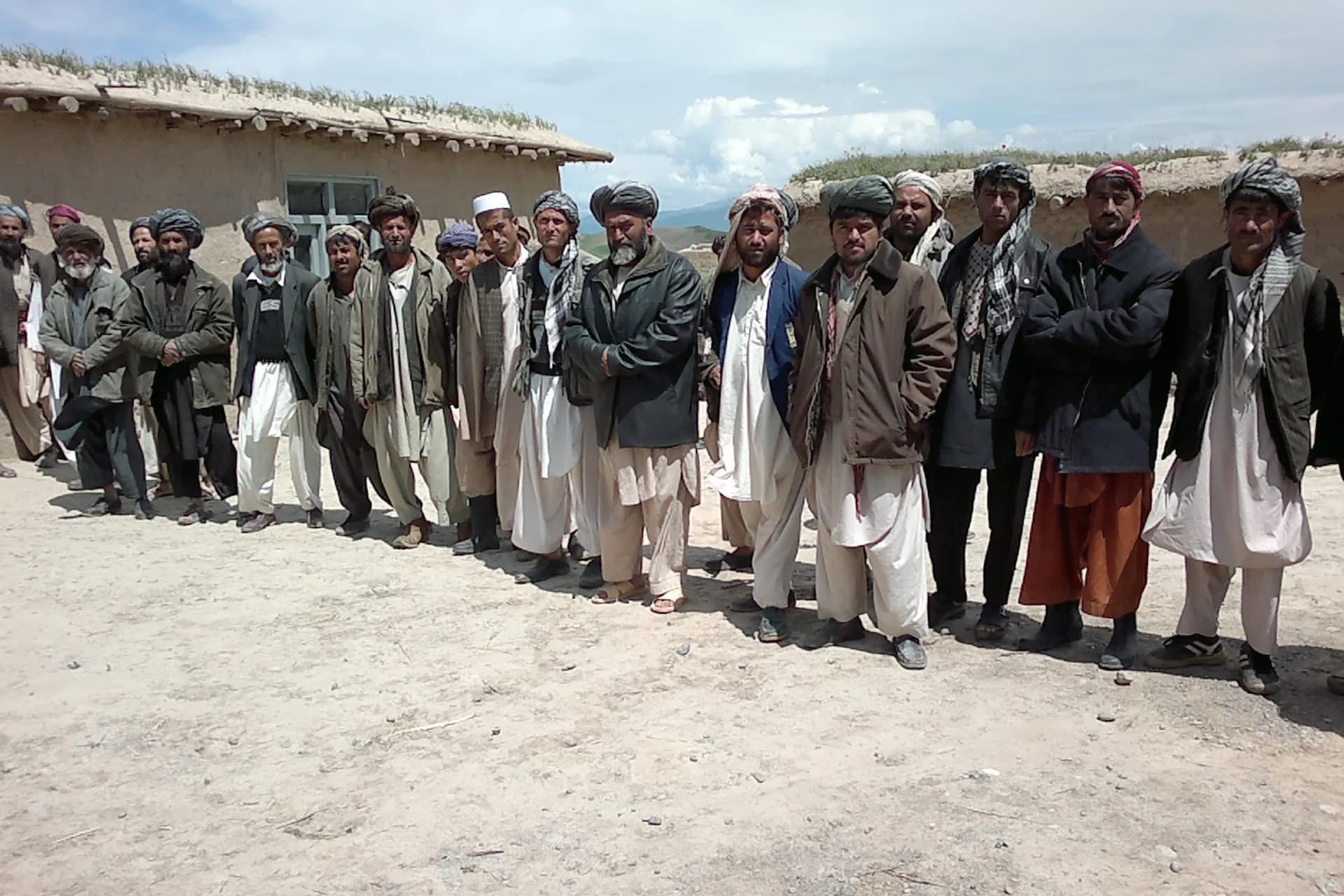 Baloch men standing together in Qaradingo, Rustaq district, Takhar Province