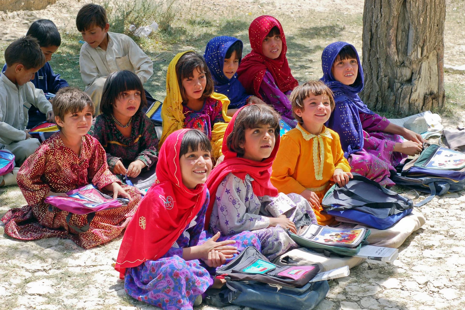 Girls learning together in an orchard classroom in Bamozai, Paktia