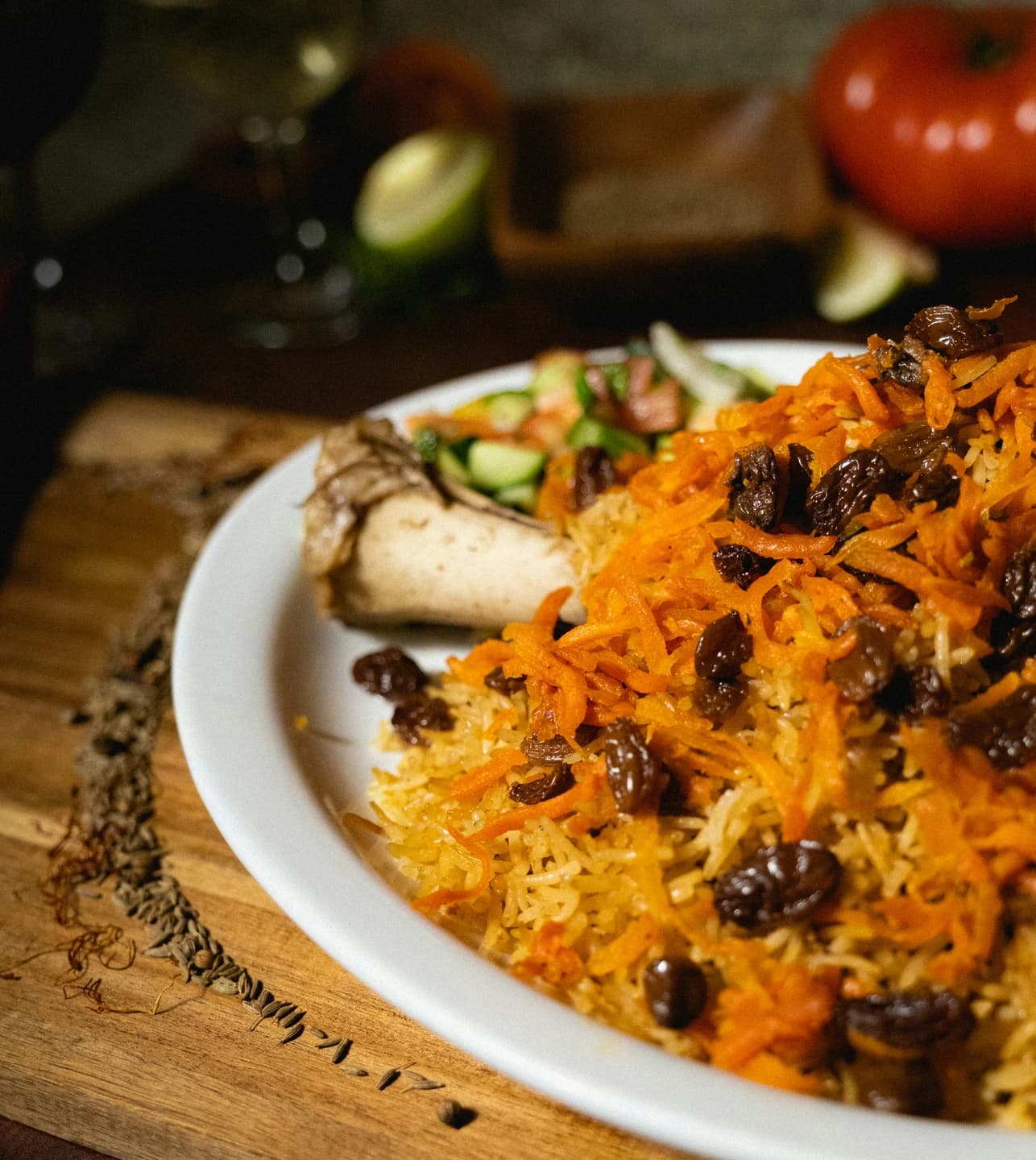 An Afghan restaurant meal with rice and garnishes