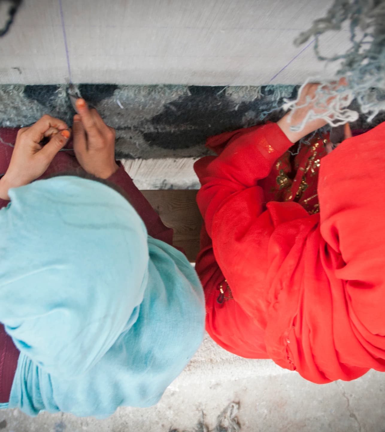 Women weaving a carpet at Arzu Studio Hope in Bamyan, Afghanistan