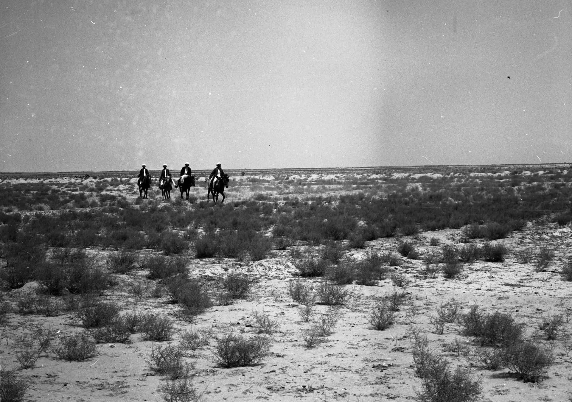 Riders crossing the steppe from Dawlatabad toward Turkmen settlements near the Zadyan minaret, Balkh, 1976